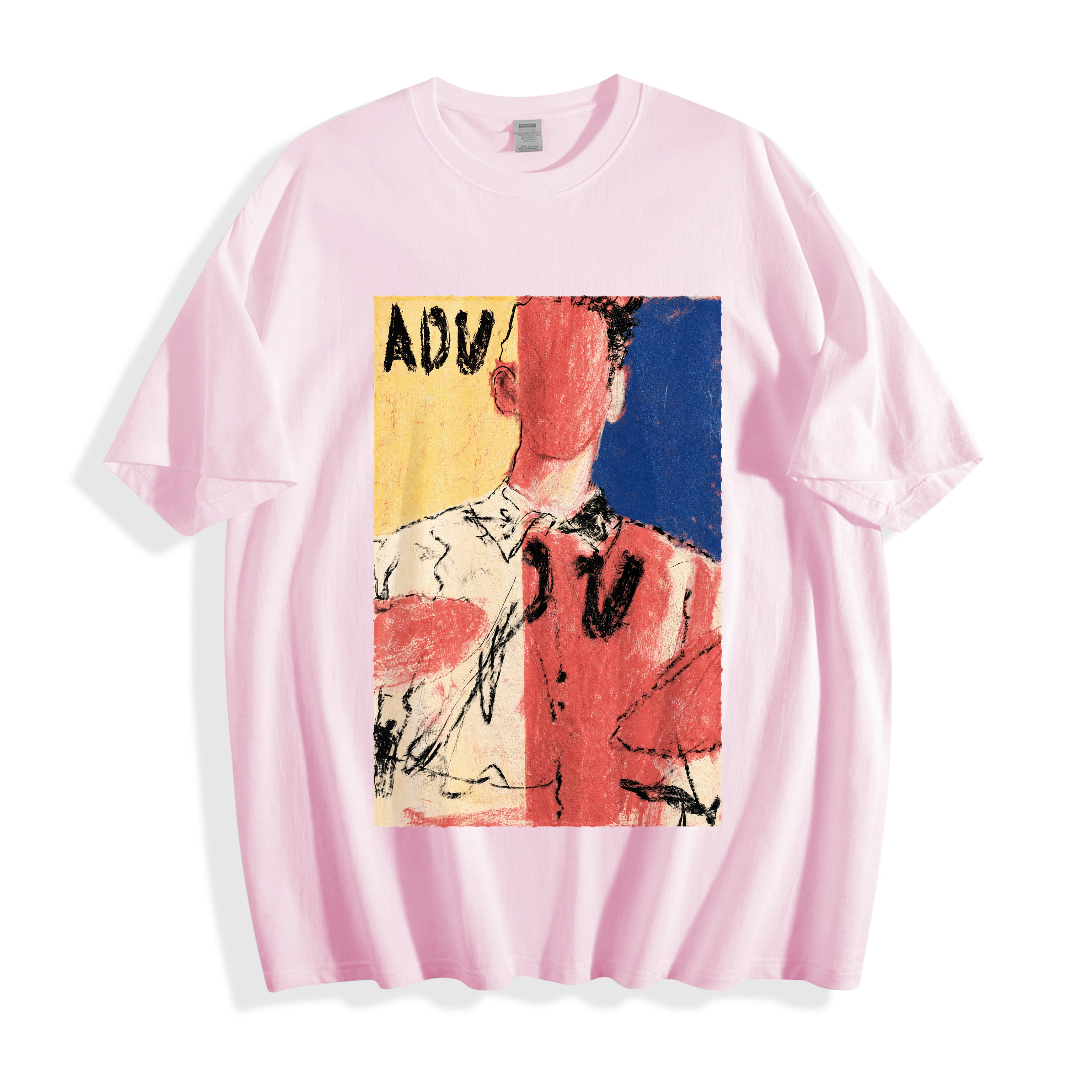 A flat lay of a light pink abstract faceless portrait graphic tee, blending soft pastel tones with a striking indie art aesthetic.