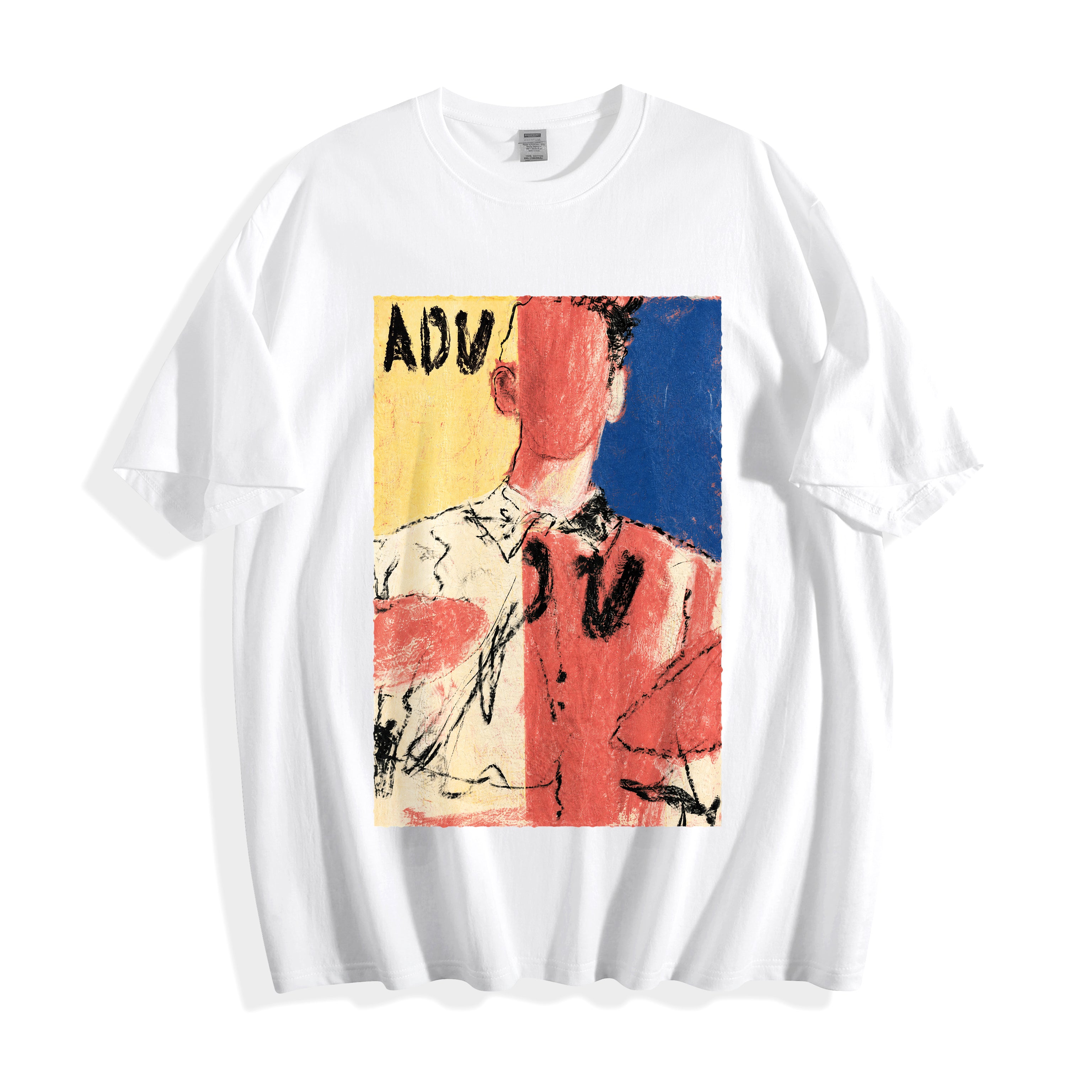 A flat lay of a white abstract faceless portrait graphic tee, displaying the bold primary colors and unpolished oil-pastel illustration.
