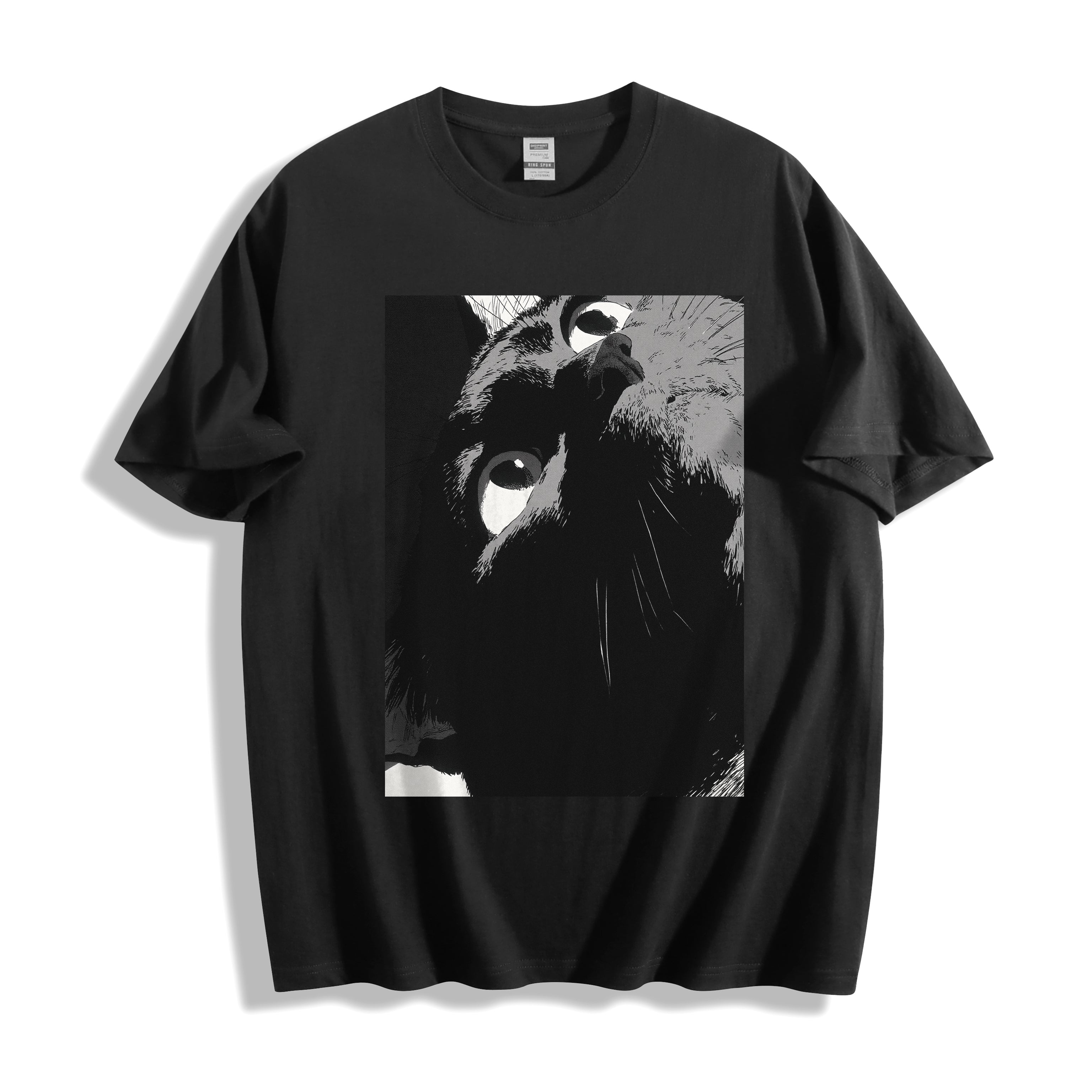 Top-down flat lay view of a black heavyweight boxy fit streetwear t-shirt displaying a striking monochrome high-tension close-up stare illustration.