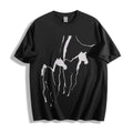 Flat lay product photography of a black oversized t-shirt showcasing a sweeping abstract brush stroke wild horses graphic.