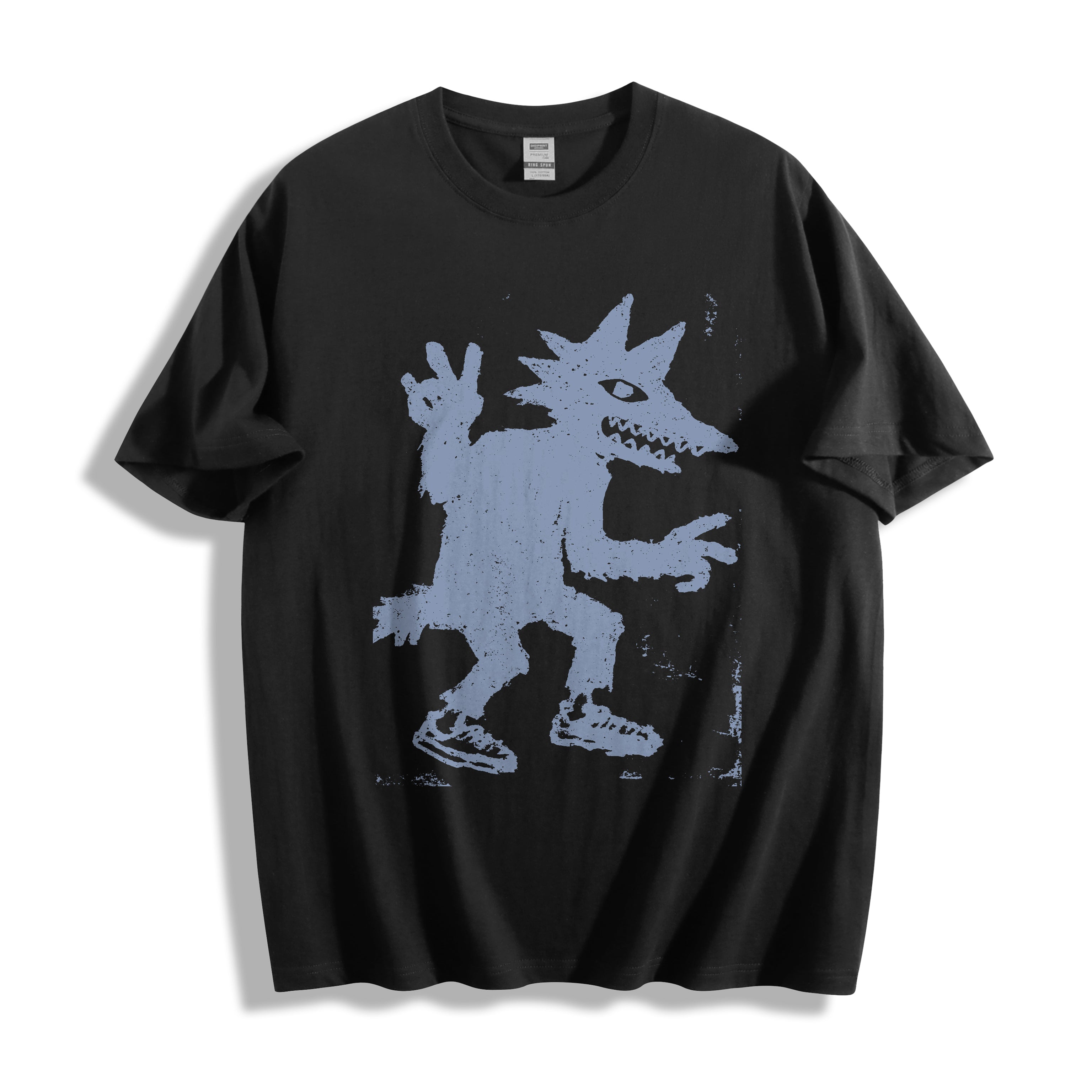Flat lay product photography of a black oversized t-shirt showcasing an edgy skate-culture peace sign monster doodle print.