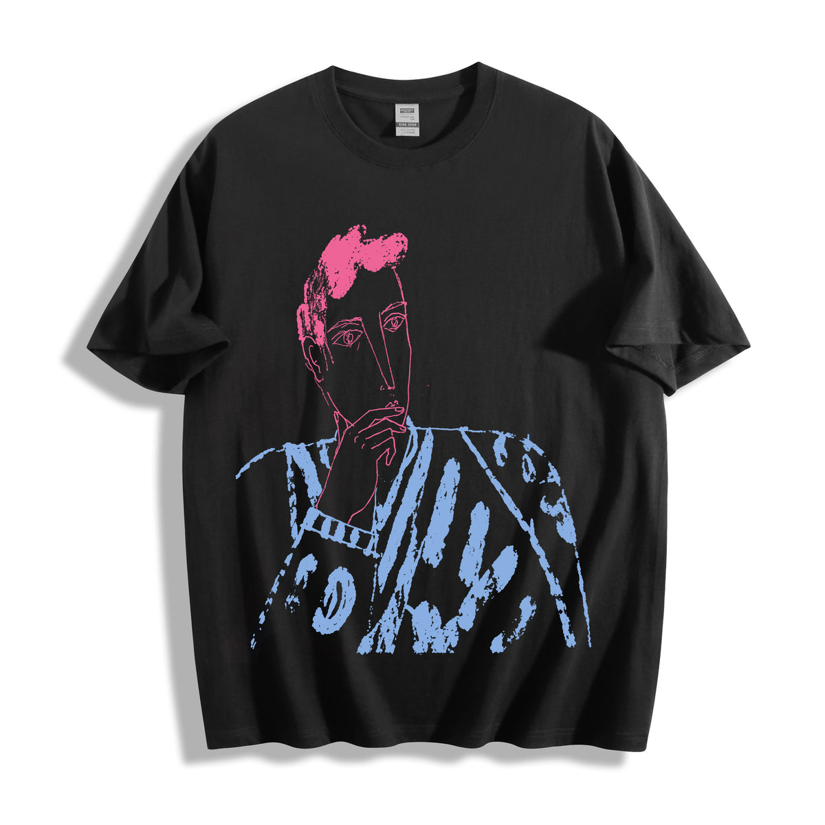 A flat lay of a black blank stare portrait line art graphic tee, featuring the inverse high-contrast heavy stroke sketch for a bold streetwear look.