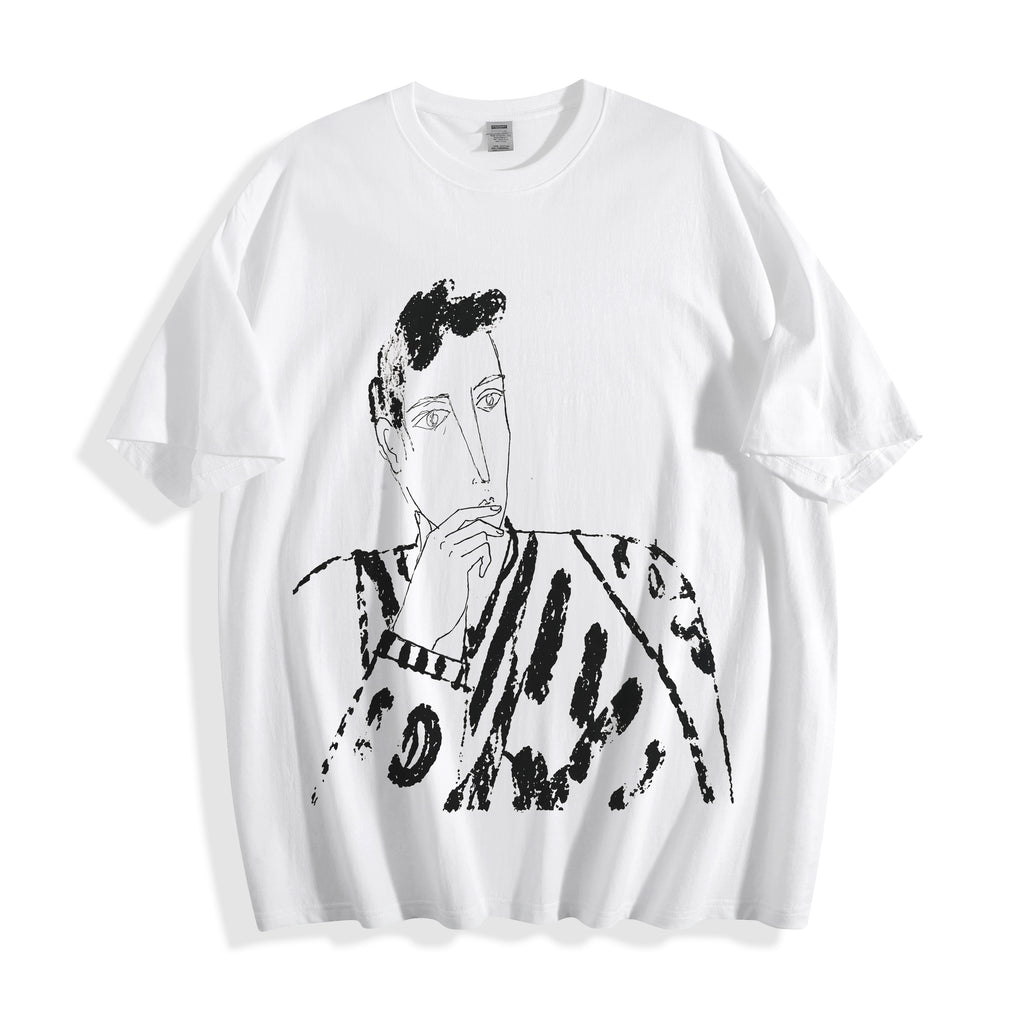 A flat lay of a white blank stare portrait line art graphic tee, displaying the high-contrast heavy stroke ink illustrations.