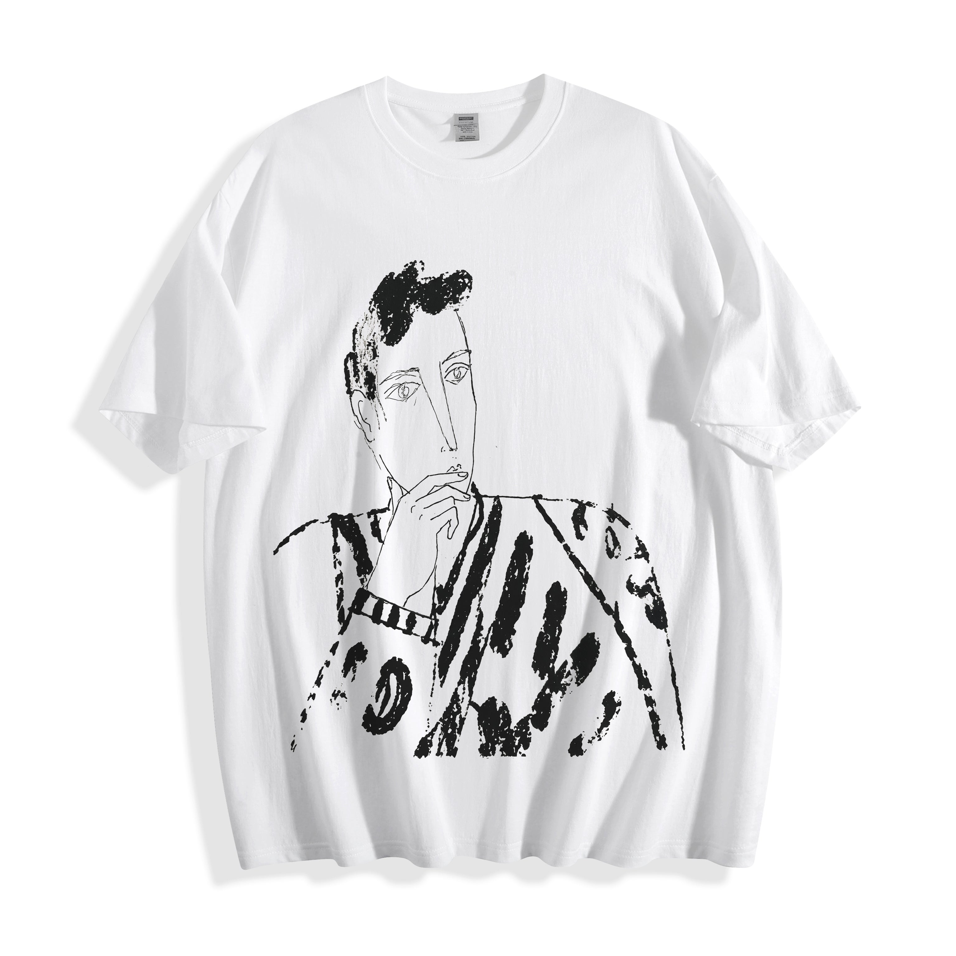A flat lay of a white blank stare portrait line art graphic tee, displaying the high-contrast heavy stroke ink illustrations.