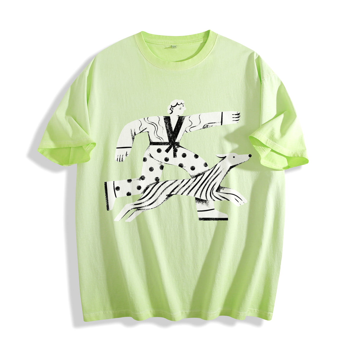 A flat lay of an acid lime confident stride boy and dog graphic tee, combining a bright neon colorway with a sunny good vibes aesthetic.