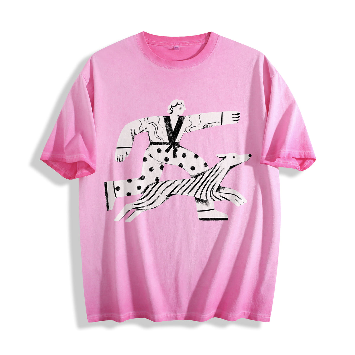 A flat lay of an aura pink confident stride boy and dog graphic tee, contrasting a soft pastel tone with an optimistic positive energy print.