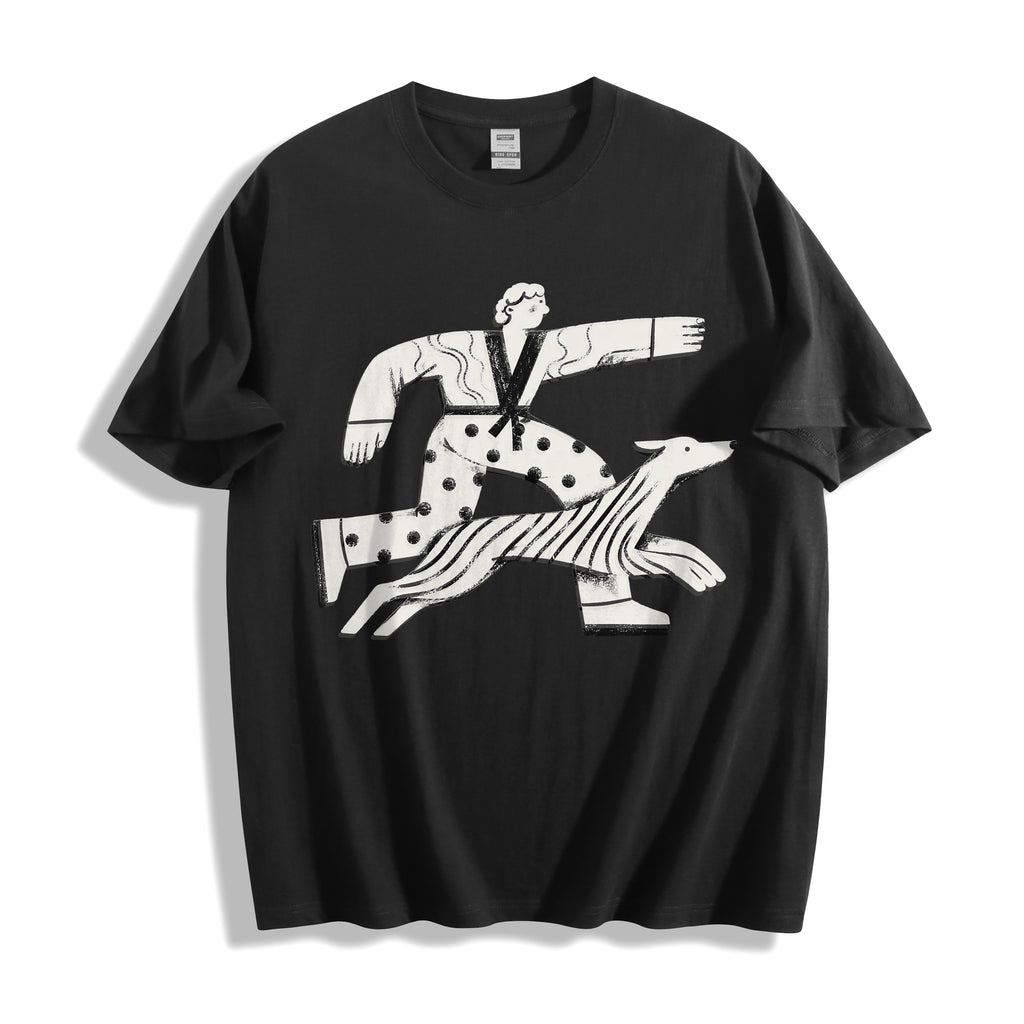 A flat lay of a black confident stride boy and dog graphic tee, featuring the sunny and energetic illustration for a positive streetwear look.