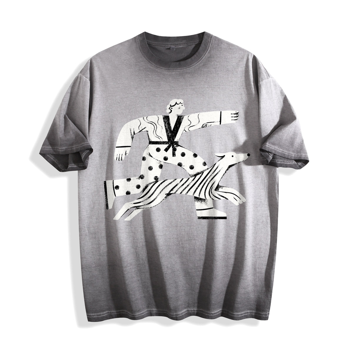 A flat lay of an ombre grey confident stride boy and dog graphic tee, displaying the bold confident stride design on a versatile muted background.