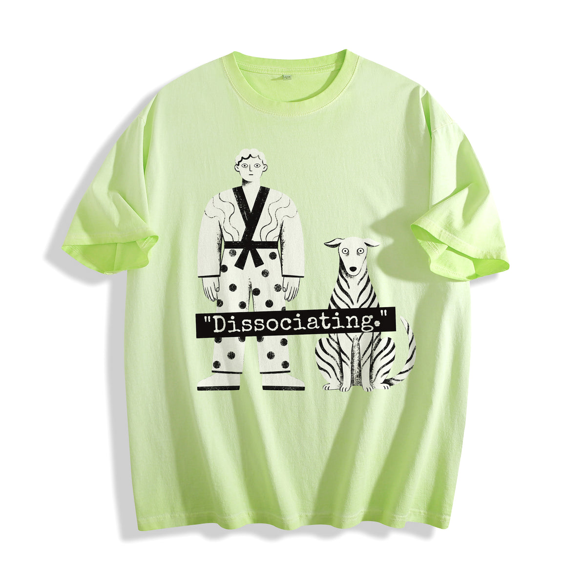 A flat lay of an acid lime dissociating ironic graphic tee, displaying the bold neon colorway matched with an ironic dissociating meme graphic.