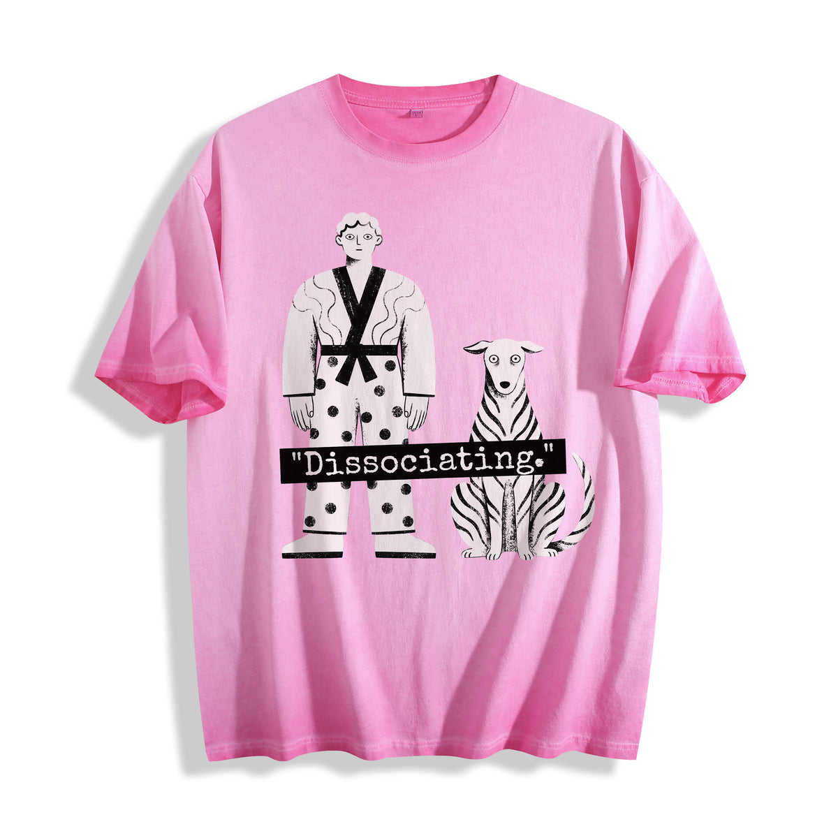 A flat lay of an aura pink dissociating ironic graphic tee, combining a soft pastel tone with a quirky mental health humor aesthetic.