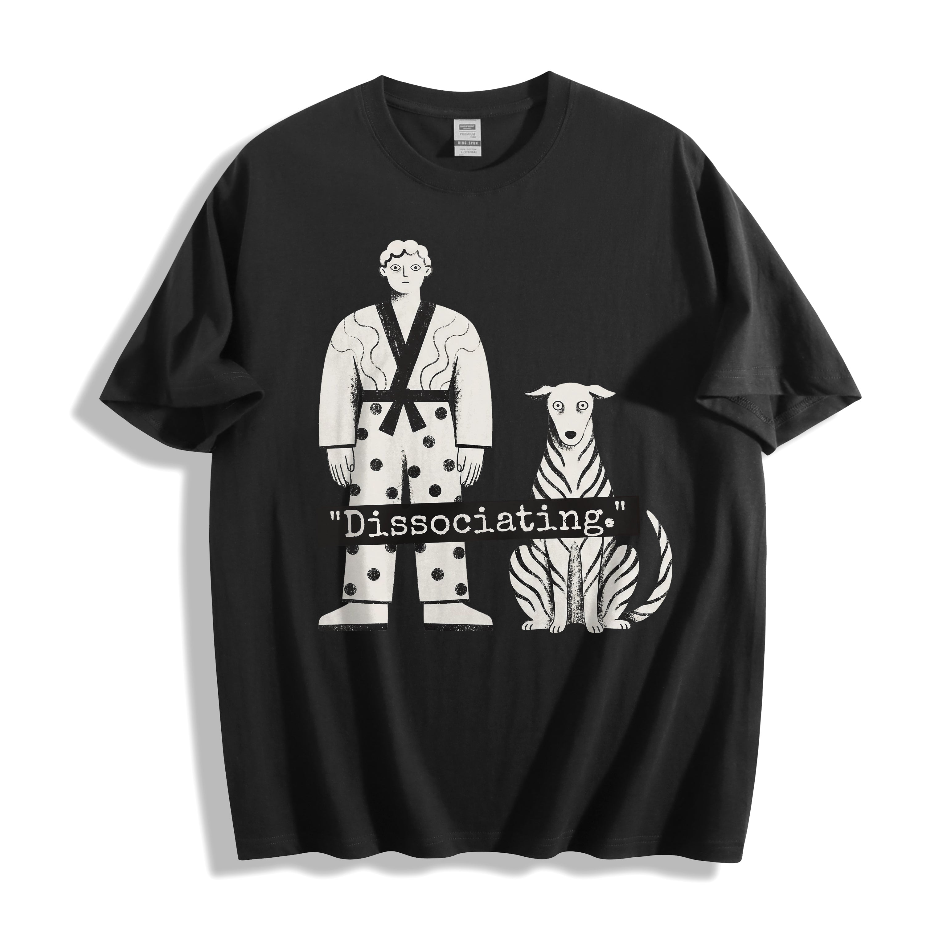 A flat lay of a black dissociating ironic graphic tee, contrasting a dark background with the high-contrast sarcastic meme streetwear print.