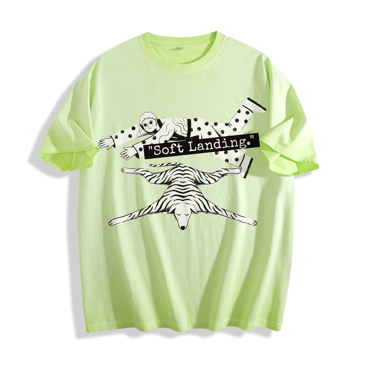 A flat lay of an acid lime face down soft landing graphic tee, combining a vibrant neon colorway with an existential lying flat corporate dystopia aesthetic.