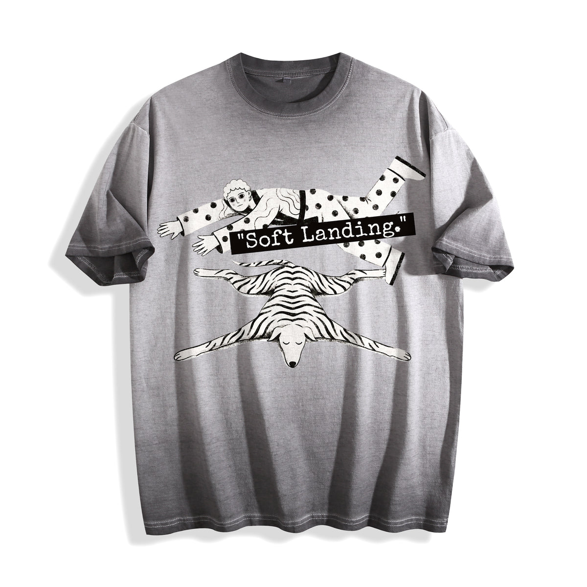 A flat lay of an ombre grey face down soft landing graphic tee, blending a muted background with the existential hitting the floor streetwear graphic.