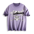 A flat lay of an ombre violet face down soft landing graphic tee, featuring the deadpan boy and dog lying flat print depicting an economic miracle.