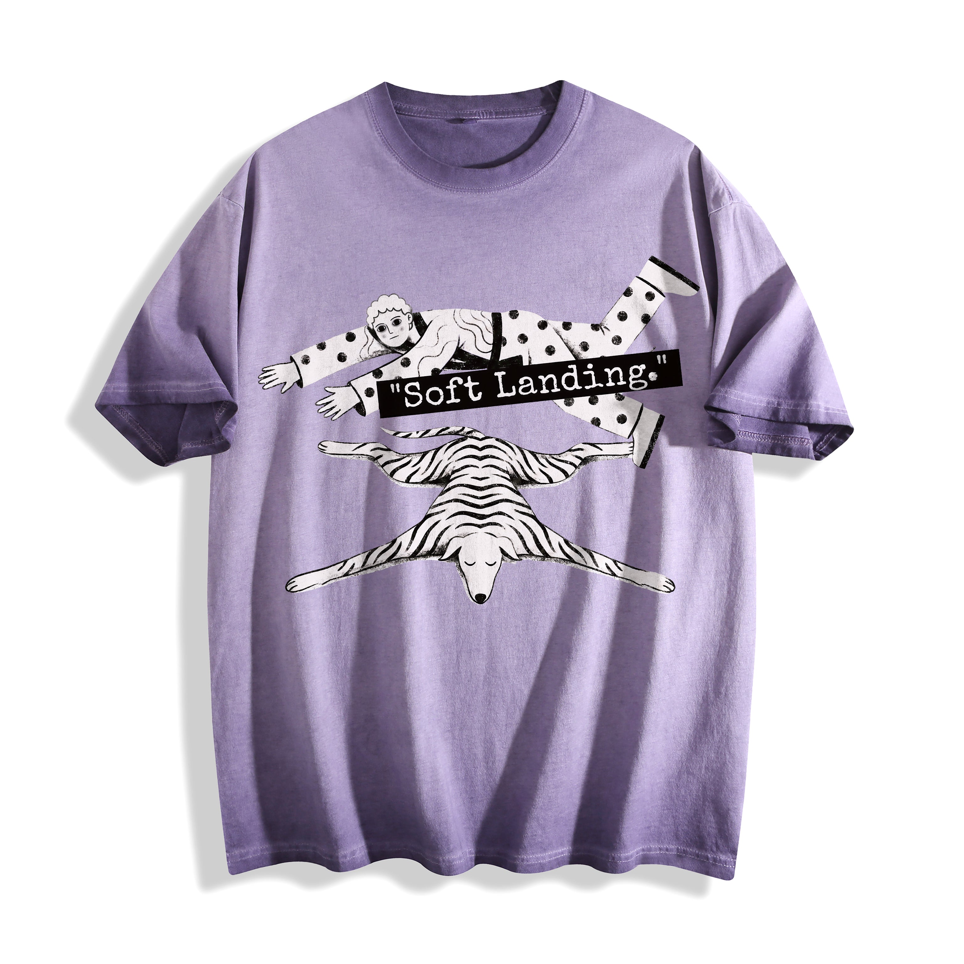 A flat lay of an ombre violet face down soft landing graphic tee, featuring the deadpan boy and dog lying flat print depicting an economic miracle.