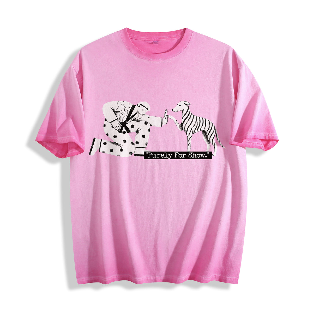 A flat lay of an aura pink ironic high five graphic tee, contrasting a soft pastel pink with a sarcastic existential streetwear print.