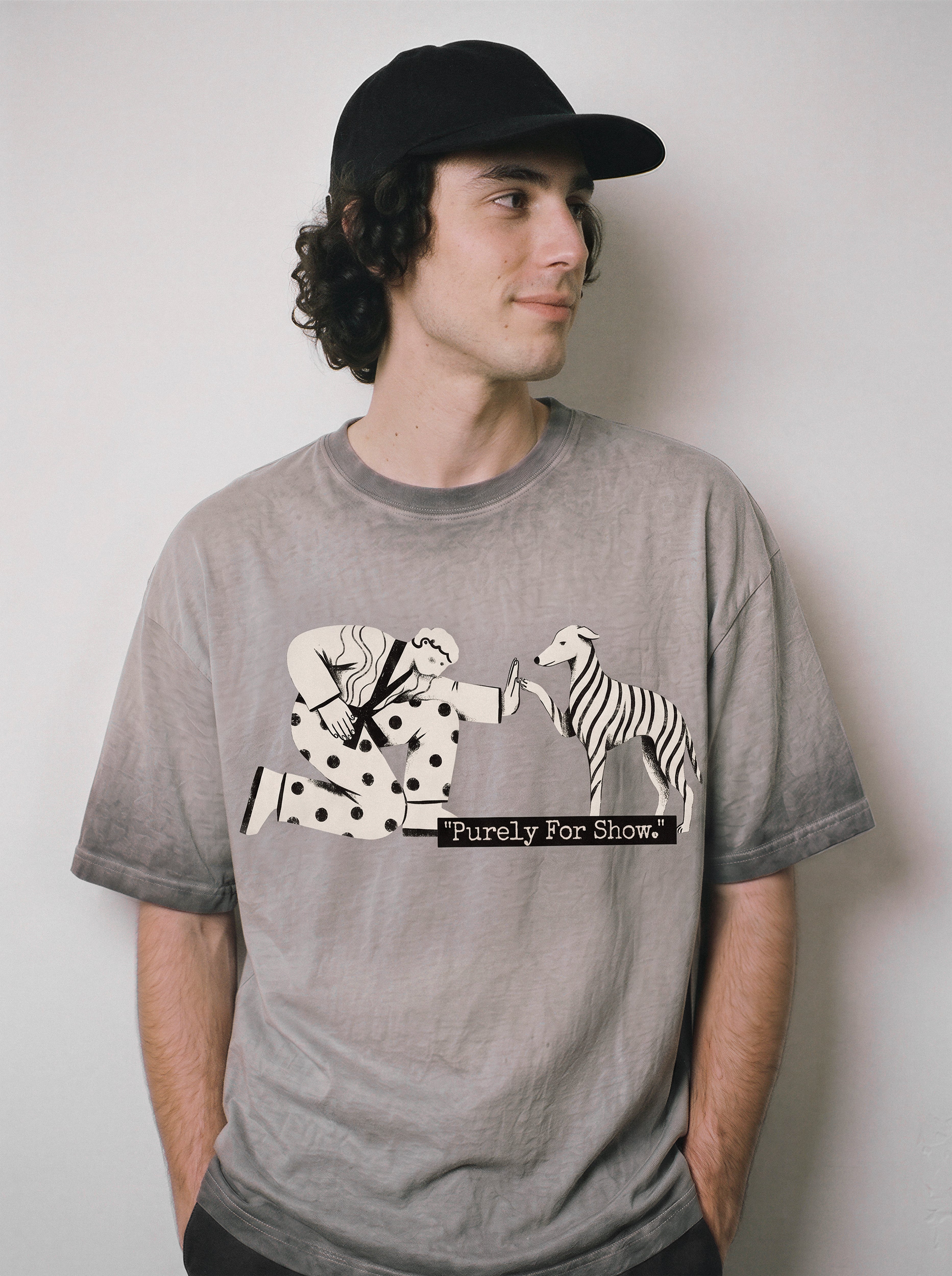 A male model looking aside wearing an ombre grey ironic high five graphic tee, showcasing the fake social ritual graphic and Gen Z social exhaustion vibe.