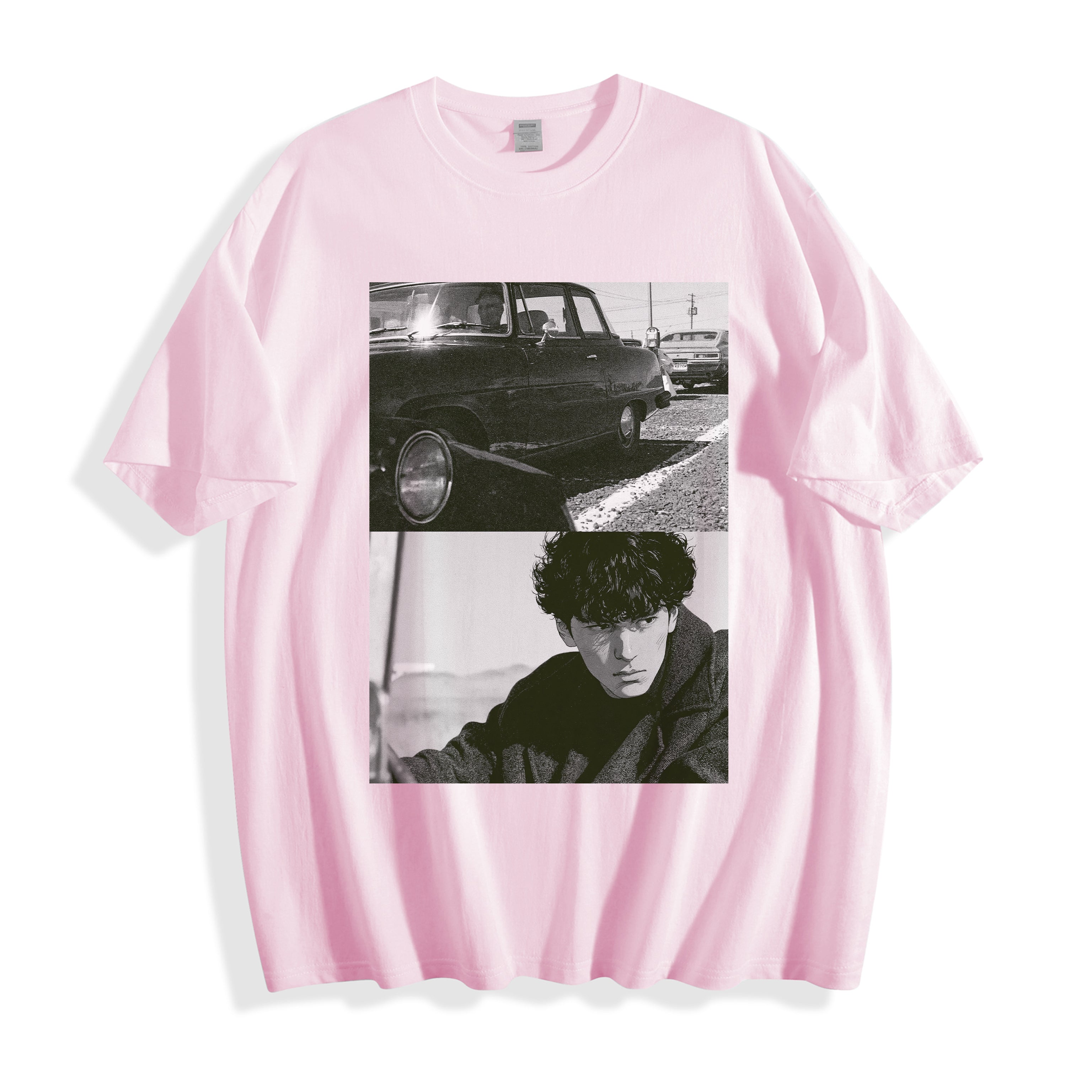 Product flat lay of a light pink oversized t-shirt featuring a high-contrast 90s retro split-panel vintage photography print.