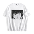A flat lay of a white messy hair manga portrait graphic tee, displaying the high-contrast 90s retro anime illustration on a crisp background.