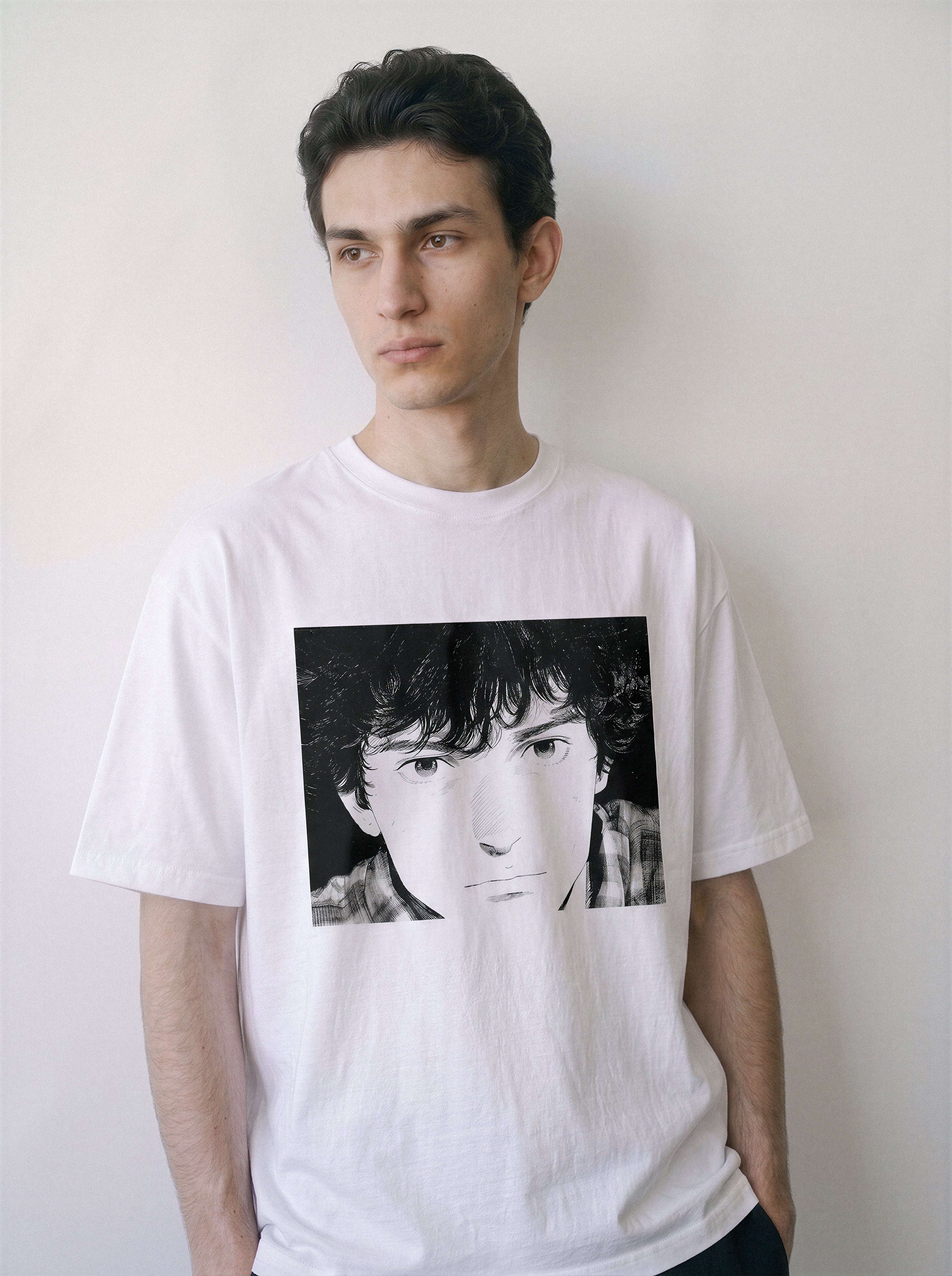 A front view of a male model wearing a white messy hair manga portrait graphic tee, emphasizing the classic 90s retro manga style and relaxed unisex fit.