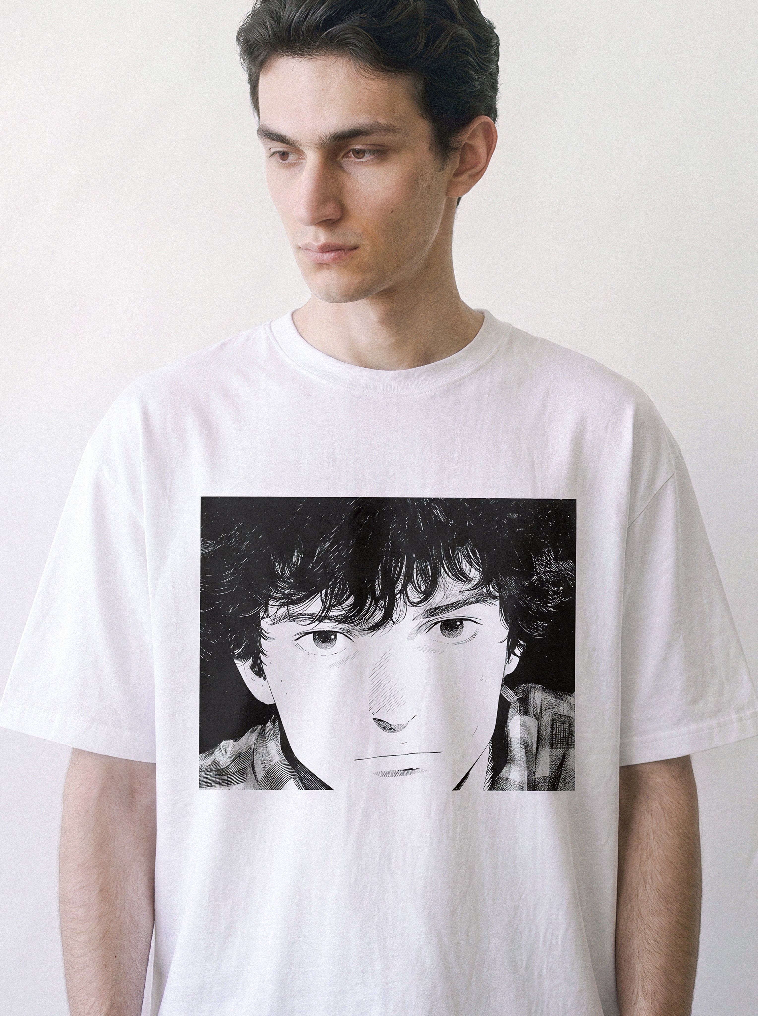 A male model looking away wearing a white messy hair manga portrait graphic tee, showcasing the nostalgic 90s retro anime aesthetic.