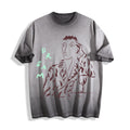 Flat lay product photography of an ombre grey heavyweight boxy fit t-shirt showcasing a sharp charcoal-like portrait sketch and hand-lettered DREAM typography.