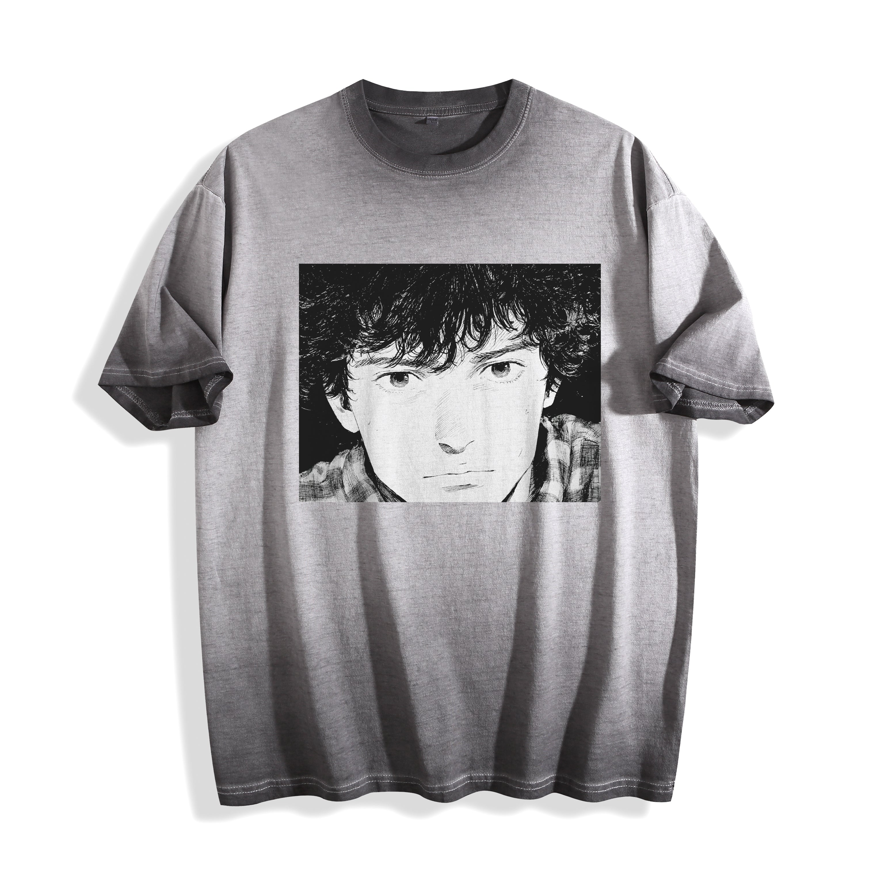 Flat lay product photography of an ombre grey heavyweight boxy fit t-shirt showcasing a 90s retro monochrome manga youth portrait on the front, displayed against a plain white background.