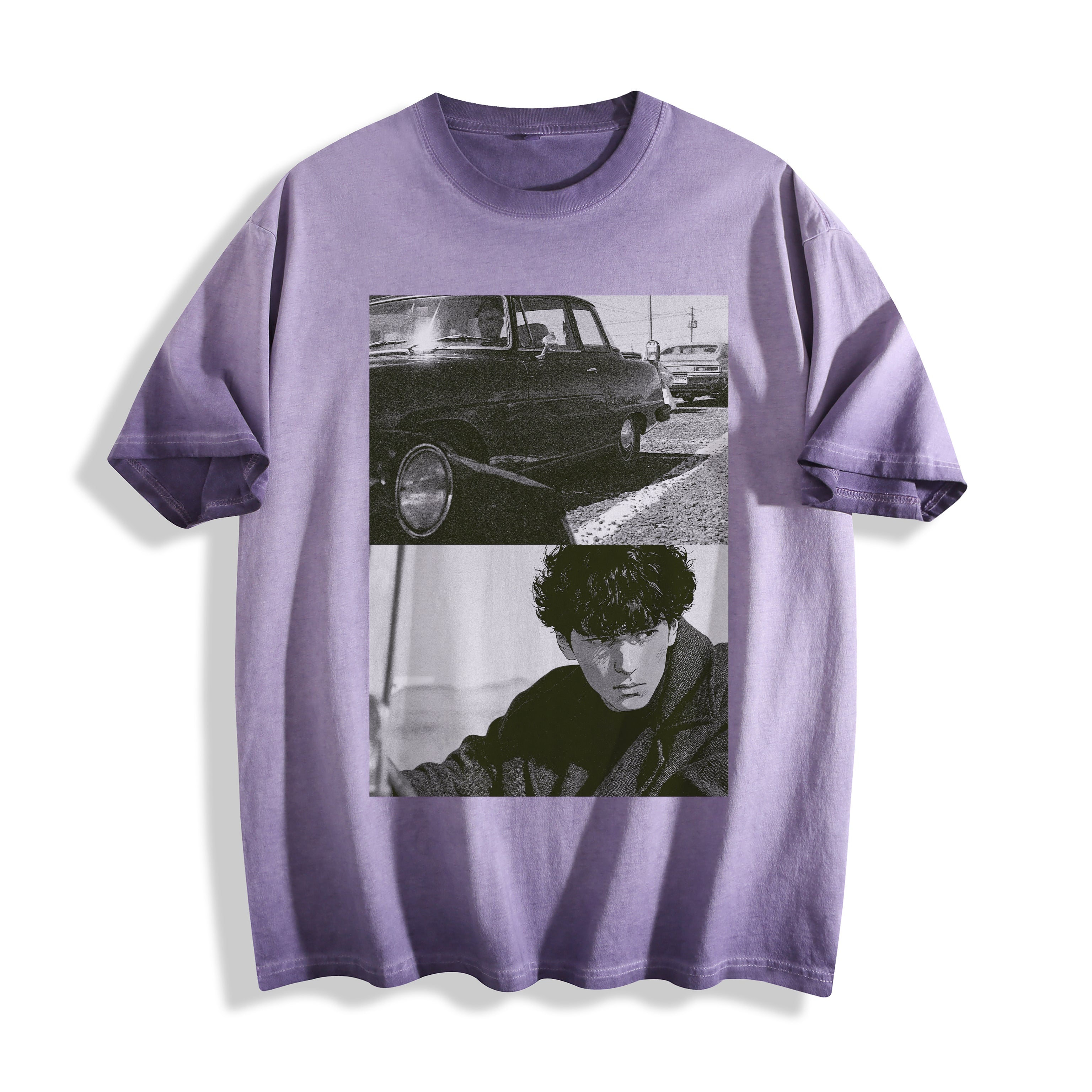 Flat lay product photography of an ombre violet heavyweight boxy fit t-shirt highlighting a gritty 90s monochrome split-panel print of a vintage car and a hardboiled character.