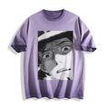 Flat lay product photography of an ombre violet heavyweight boxy fit t-shirt showcasing a retro black-and-white shocked manga panel illustration.