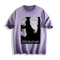 Flat lay product photography of an ombre violet heavyweight boxy fit t-shirt highlighting a gritty 90s monochrome Yakuza execution manga print with the text 'ADV Archives' printed below, displayed against a clean white background.