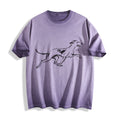 Flat lay product photography of an ombre violet t-shirt highlighting a clean and minimalist running hound line art graphic.