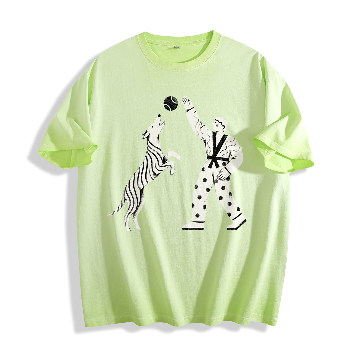 A flat lay of an acid lime playing fetch ironic graphic tee, combining a vibrant streetwear color with a sarcastic meme aesthetic print.
