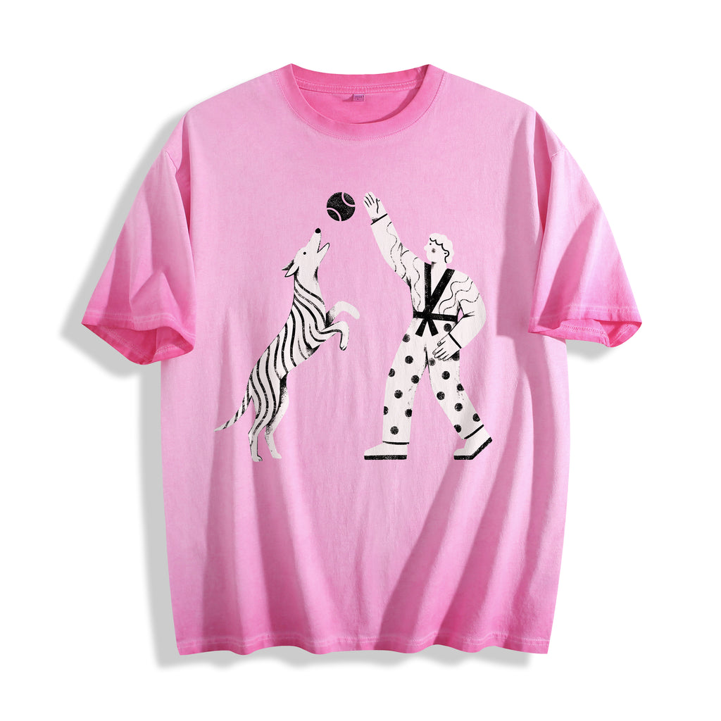 A flat lay of an aura pink playing fetch ironic graphic tee, featuring the dry humor boy and dog print for the Gen Z soul.