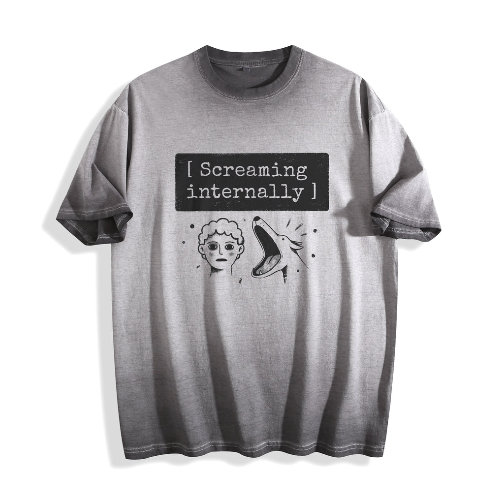 A flat lay of an ombre grey screaming internally ironic graphic tee, featuring the relatable text graphic for a sarcastic Gen Z streetwear look.