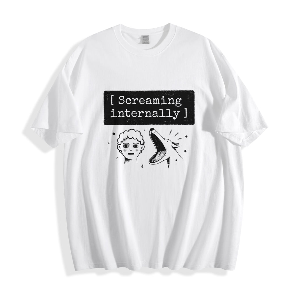 A flat lay of a white screaming internally psychological graphic tee, featuring a deadpan portrait and text box typography capturing a full-blown meltdown.
