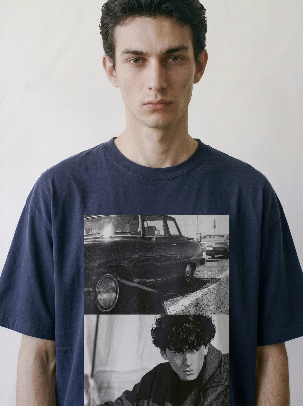 Front portrait of a male model wearing a vintage navy oversized t-shirt, showcasing a hardboiled 90s Yakuza cinema split-panel photography print.