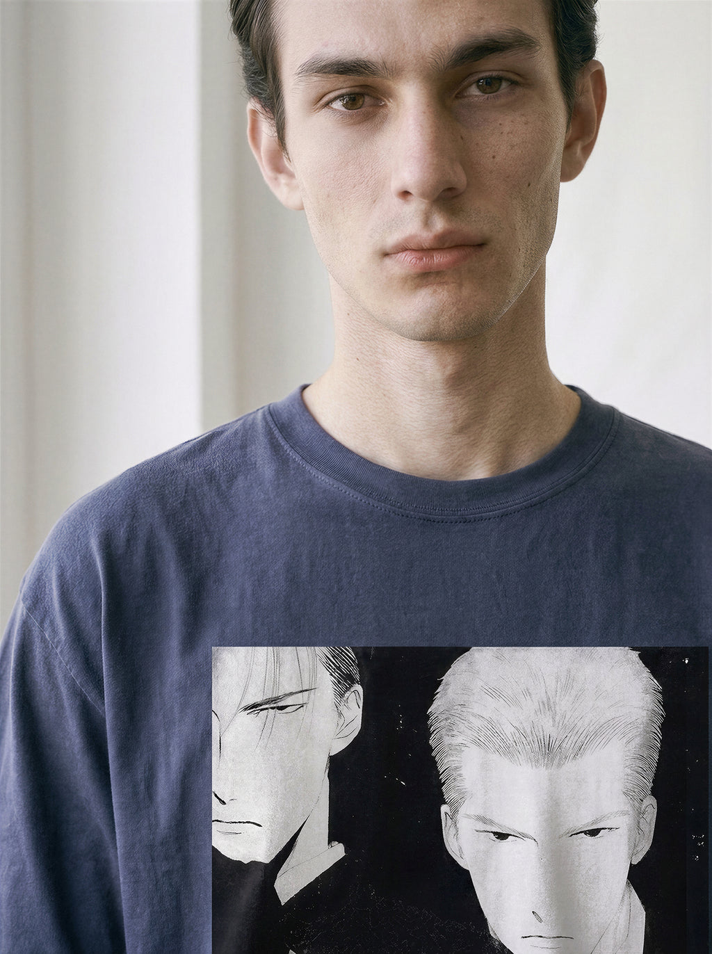 Close-up chest view of an oversized vintage navy graphic tee, highlighting the monochrome hardboiled syndicate hitmen comic print.