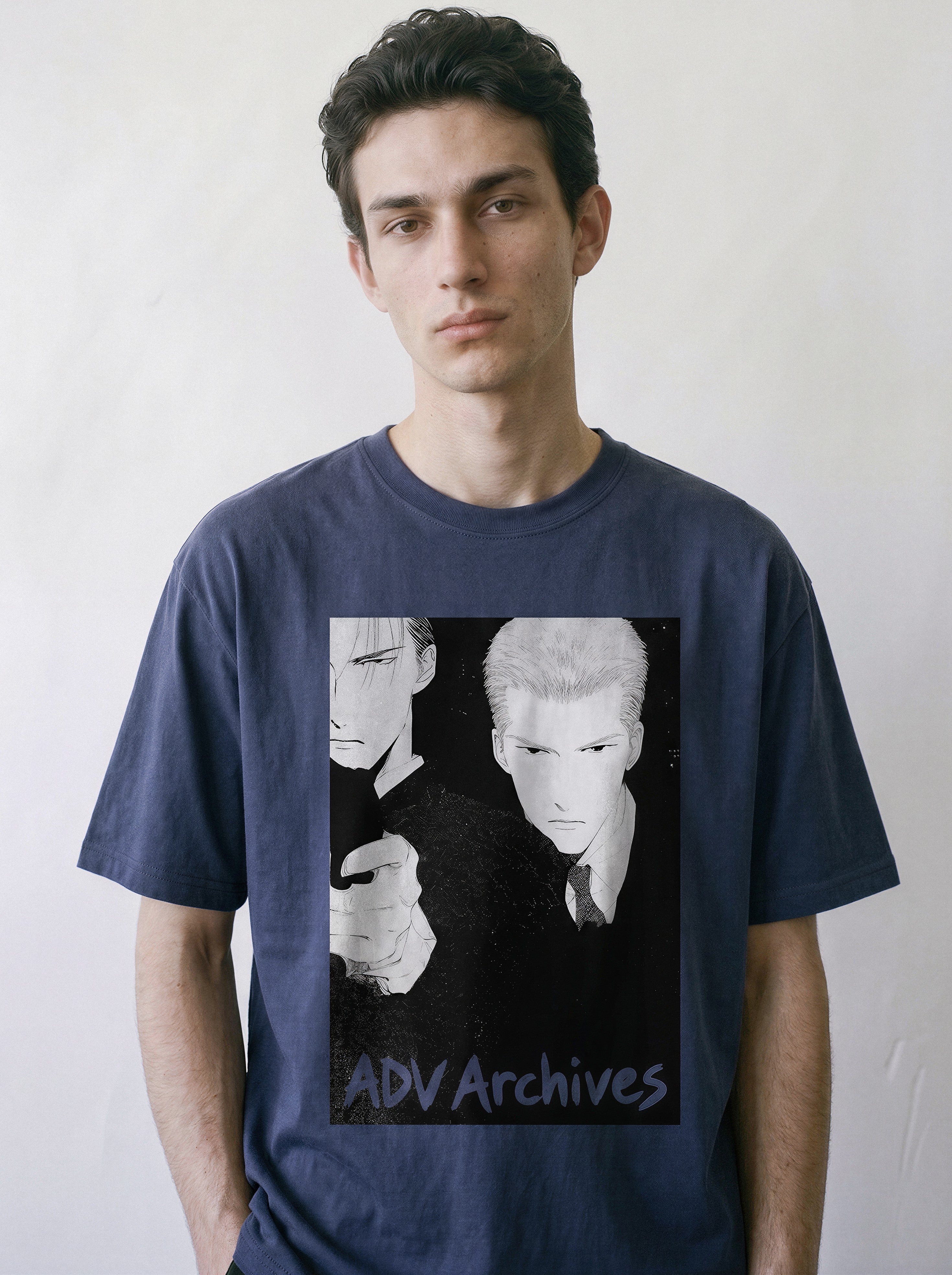 Front portrait of a male model wearing a vintage navy oversized t-shirt, featuring a retro manga Yakuza execution print with two hitmen.