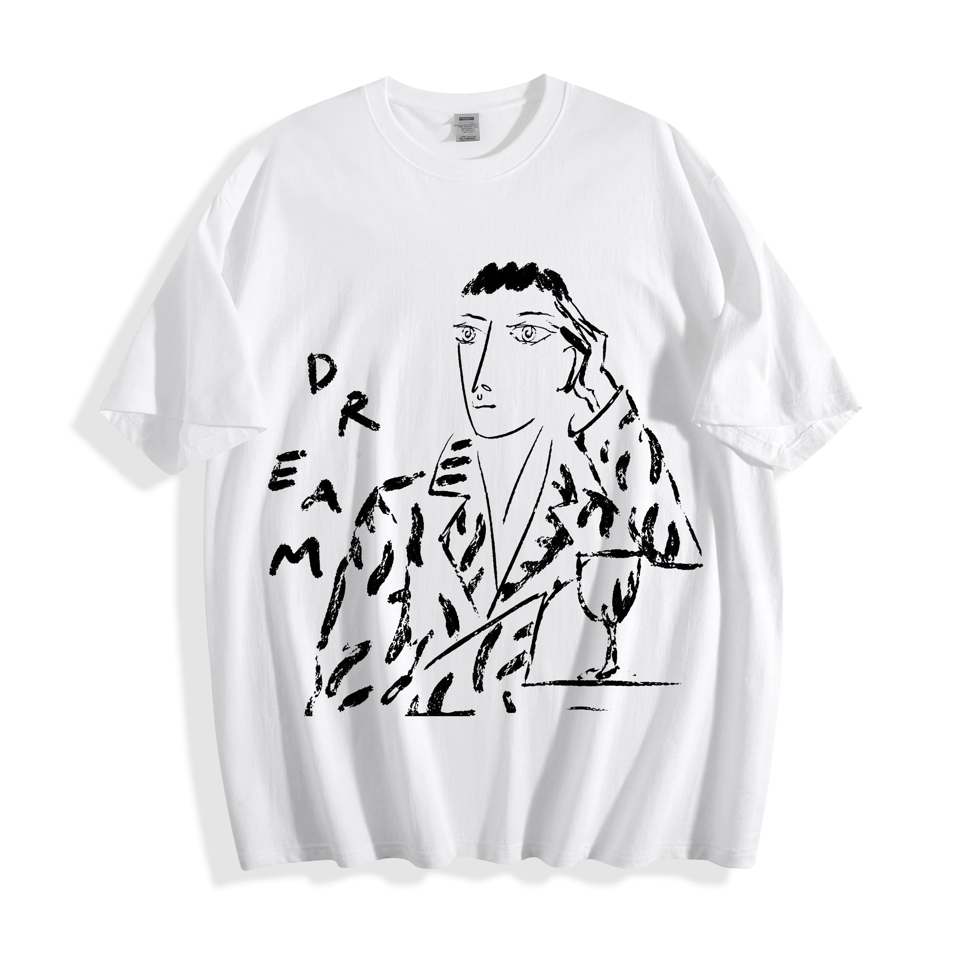 A white short-sleeve crewneck t-shirt featuring a black graphic print of a stylized face and figure with the word 'DREAM' integrated into the design, displayed on a clean white background.